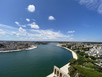 High angle view of river amidst buildings in city