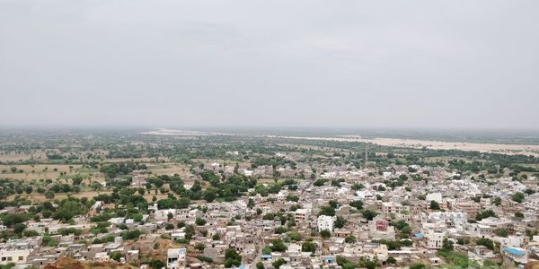 High angle view of buildings against clear sky