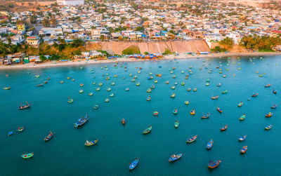 High angle view of crowd in city at sea