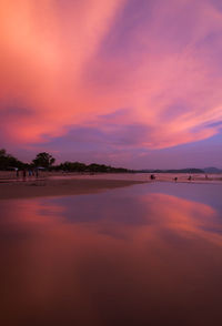 Scenic view of sea against romantic sky at sunset