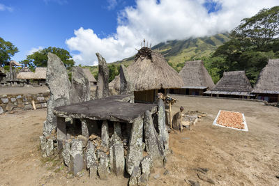 Panoramic view of houses and village against sky