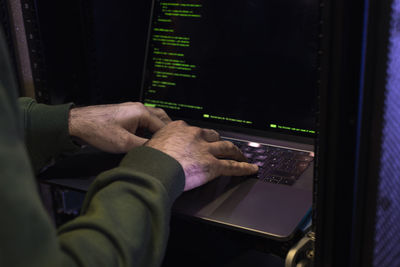 Male programmer working on laptop