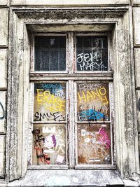 Graffiti on window of building