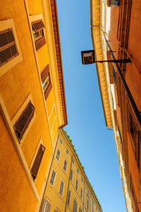 Low angle view of buildings against clear sky