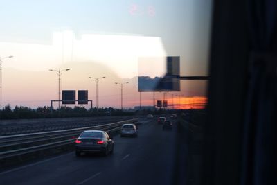 Traffic on road at dusk