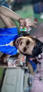 Portrait of woman with arms raised