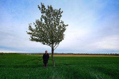 Full length of man on field against sky