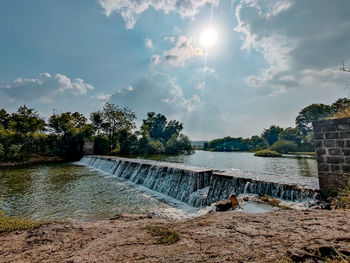 Scenic view of river against sky