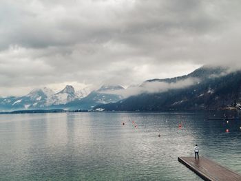 Scenic view of lake against sky during winter