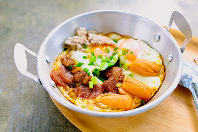 Fried egg with tomato bacon in pan breakfast morning business food still life