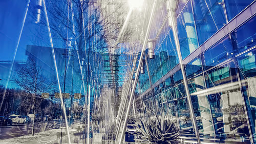 Digital composite image of modern building against blue sky