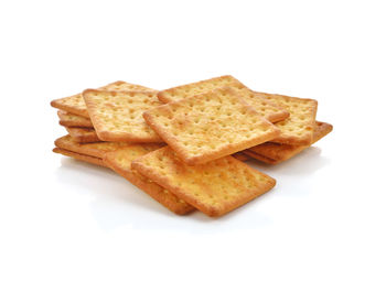 High angle view of bread in plate against white background