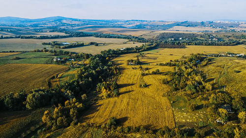 Flight over the fields behind the western ukrainian village aerial view