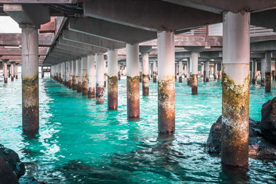 Different view of water villa concrete piers in maldives with pristine turquoise water