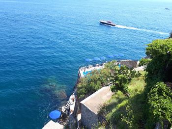 High angle view of rocks on sea
