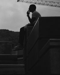 Silhouette of woman against sky