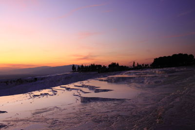 Scenic view of landscape against sky during sunset