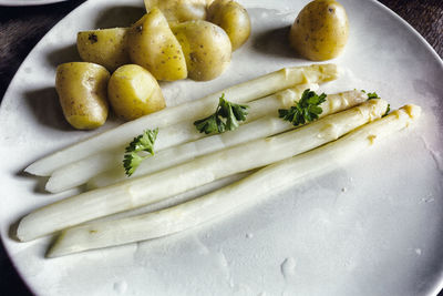 Close-up of asparagus and potatoes in plate