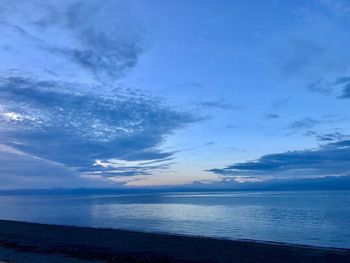 Scenic view of sea against blue sky