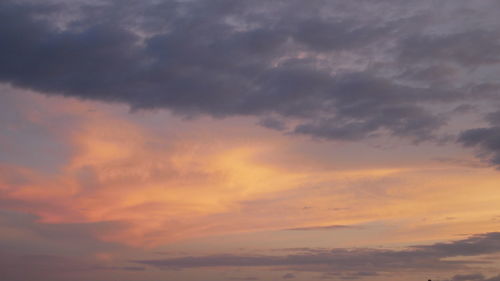 Low angle view of cloudy sky during sunset