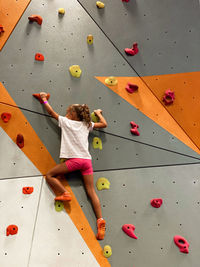 A young girl has a climbing sport
