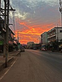 Cars on road during sunset