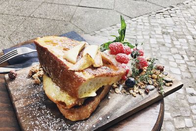 High angle view of food served on table at footpath