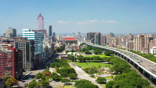 High angle view of buildings in city against sky