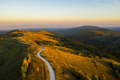 Scenic view of landscape against sky during sunset