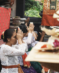 Group of people sitting in temple