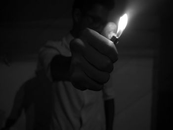 Close-up of human hand holding cigarette lighter