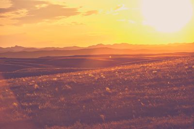 Aerial view of landscape against sky during sunset