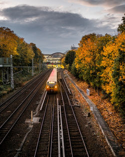 High angle view of train amidst trees against sky