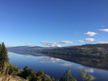 Scenic view of lake against blue sky