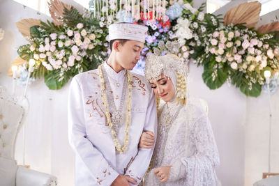Portrait of bride holding bouquet