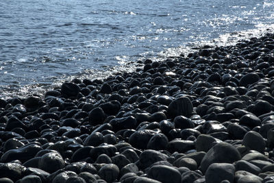 High angle view of pebbles on beach