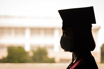 Close-up portrait of a person wearing hat