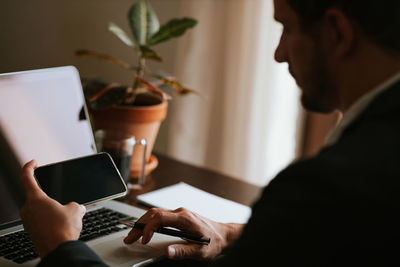 Midsection of businessman working in office