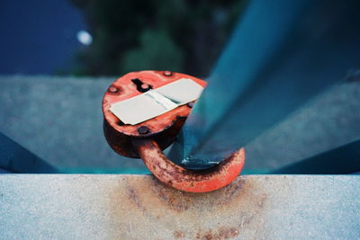 Close-up of padlock attached to railing