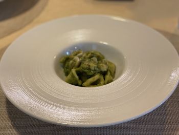 Close-up of pasta served in plate on table