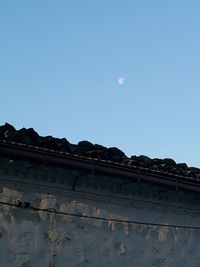 Low angle view of building against clear blue sky