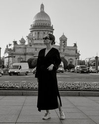 Rear view of woman walking on street in city