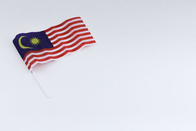 High angle view of flag against white background