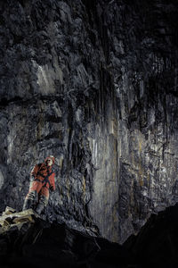 Low angle view of man in cave