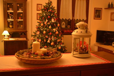 Illuminated christmas tree on table