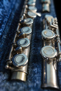 Close-up of musical instrument in blue container