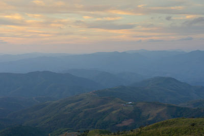 Scenic view of mountains against sky during sunset