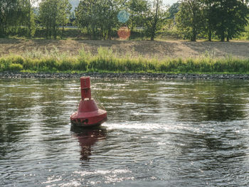 Boat floating on lake