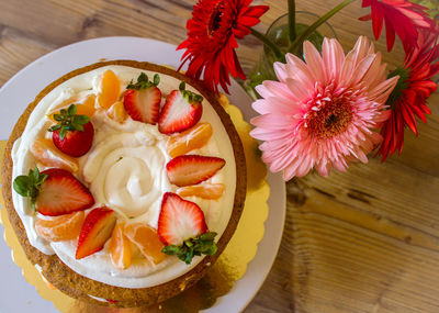 High angle view of strawberries in plate on table