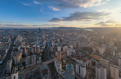 High angle view of city against sky during sunset